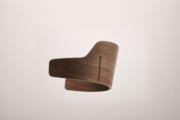 Detailed shot of a wooden backrest of the Seley armchair by Frédéric Dedelley for HorgenGlarus