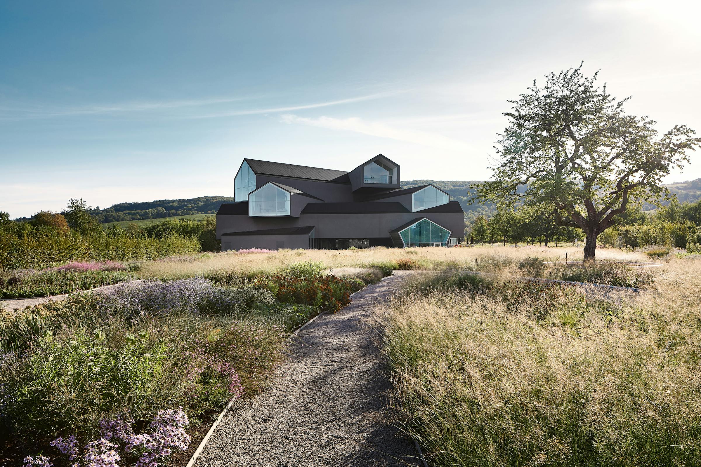 Architectural photograph of the Vitra House taken from the garden