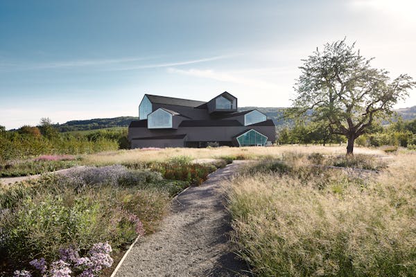 Architectural photograph of the Vitra House taken from the garden