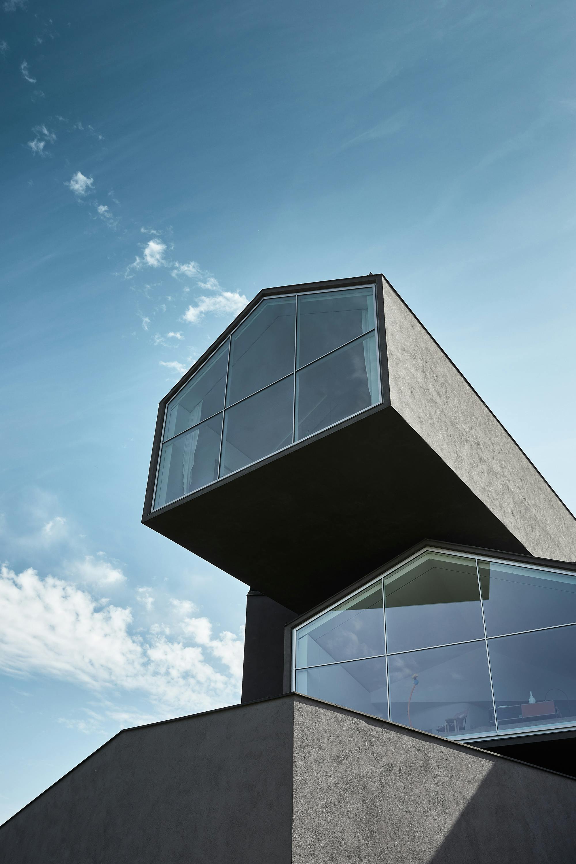 Architectural detail of the Vitra House against a blue sky