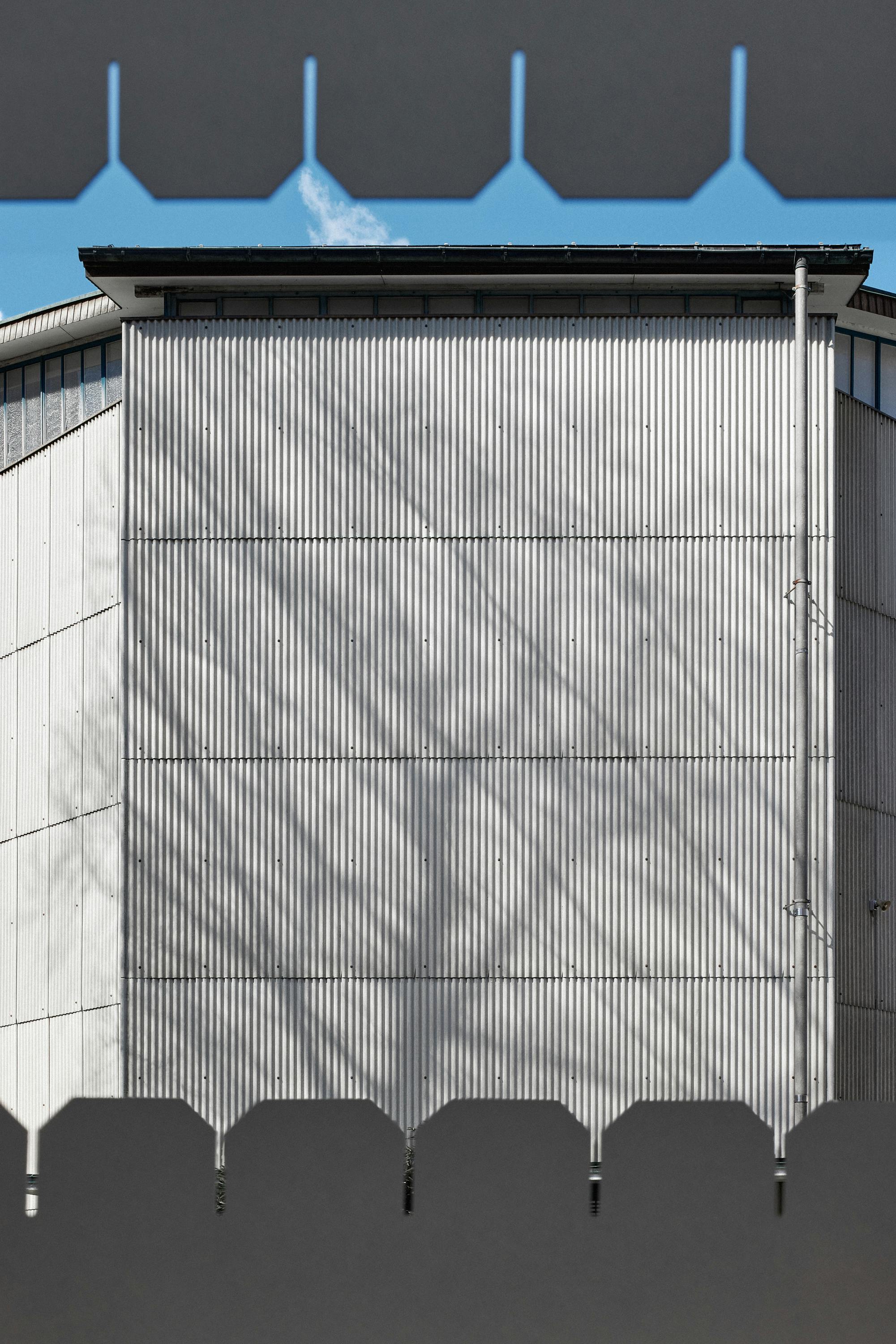 eternit facade with the shadow of a tree