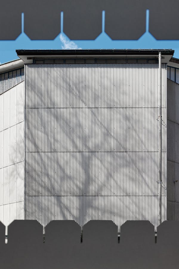 eternit facade with the shadow of a tree