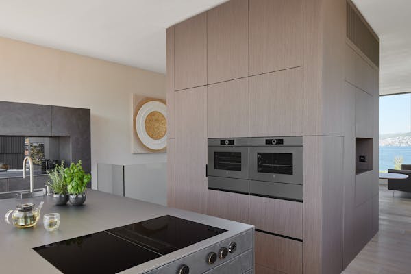 large kitchen in beige with hob and oven