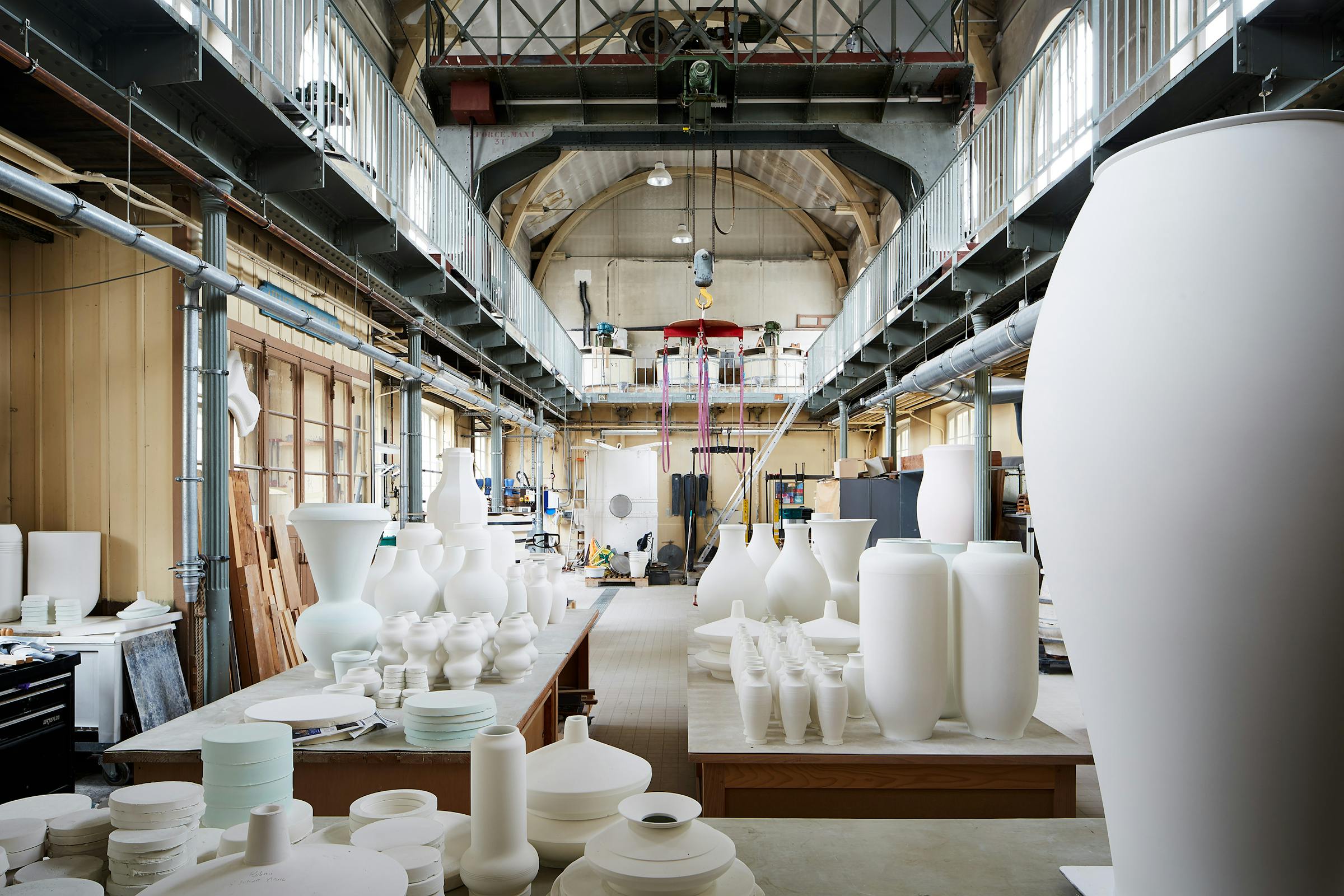 Interior of the Sévres porcelain factory with large unfired vases made from tables