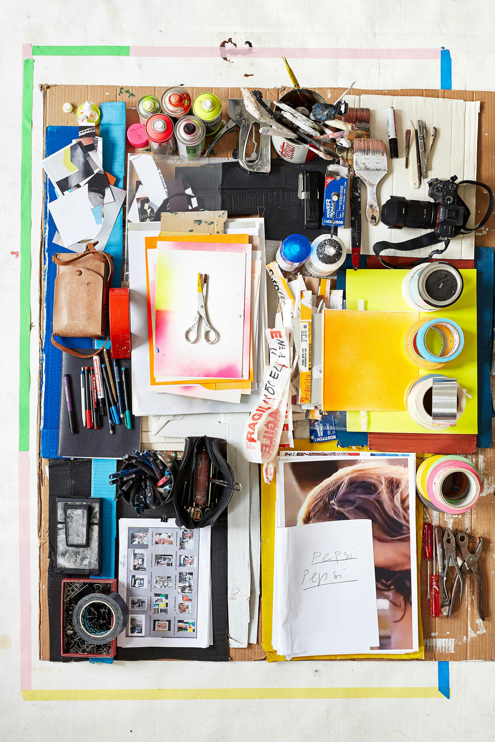 Bird's eye with a moodboard of curated objects by the artist Monique Baumann