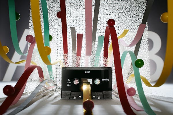 Cassette in an abstract set design with colourful loops in tongue form