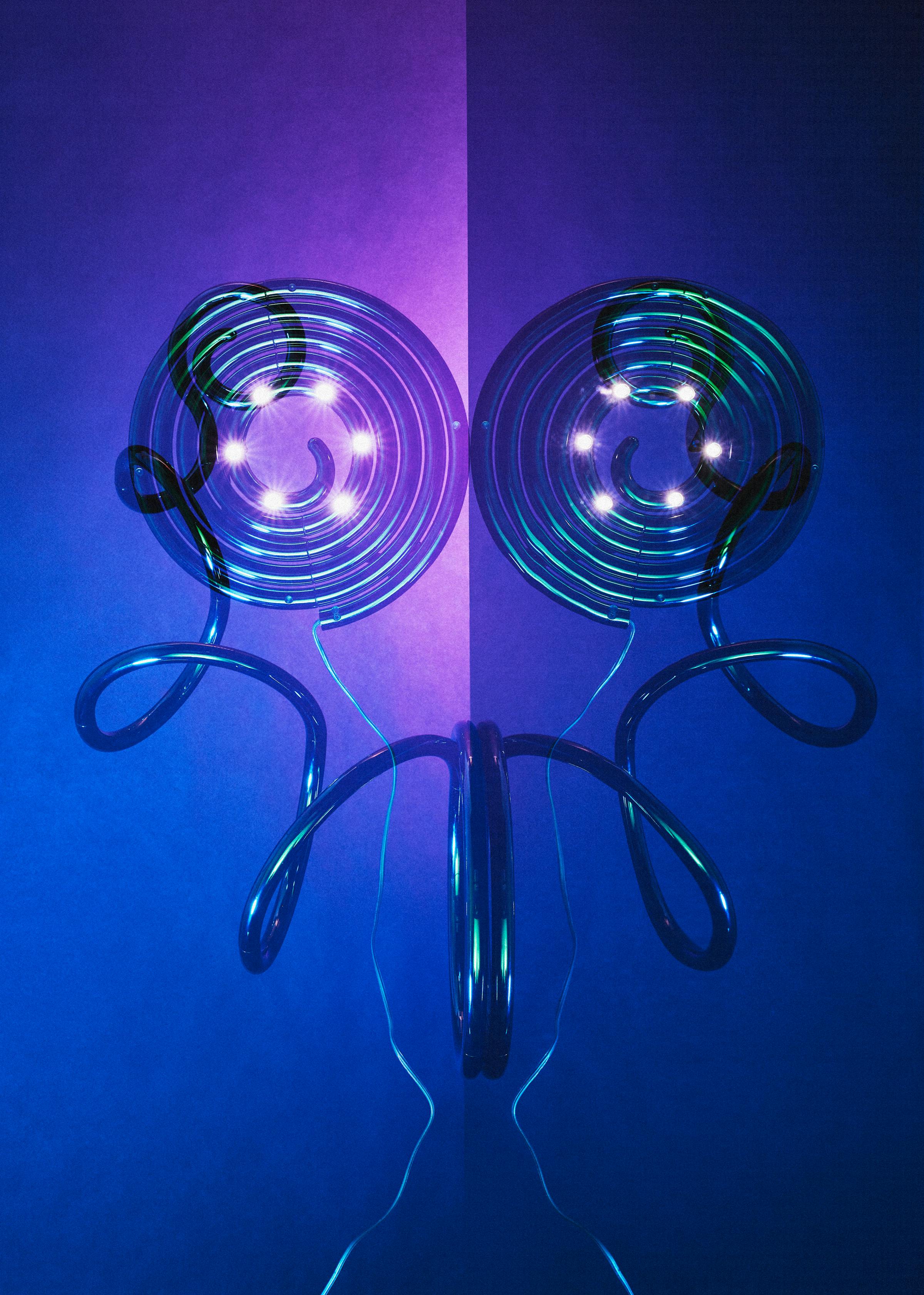 Multiple analogue exposure of the lamp Pizza Cobra by british designer Ron Arad in front of a vibrant dark blue violet background