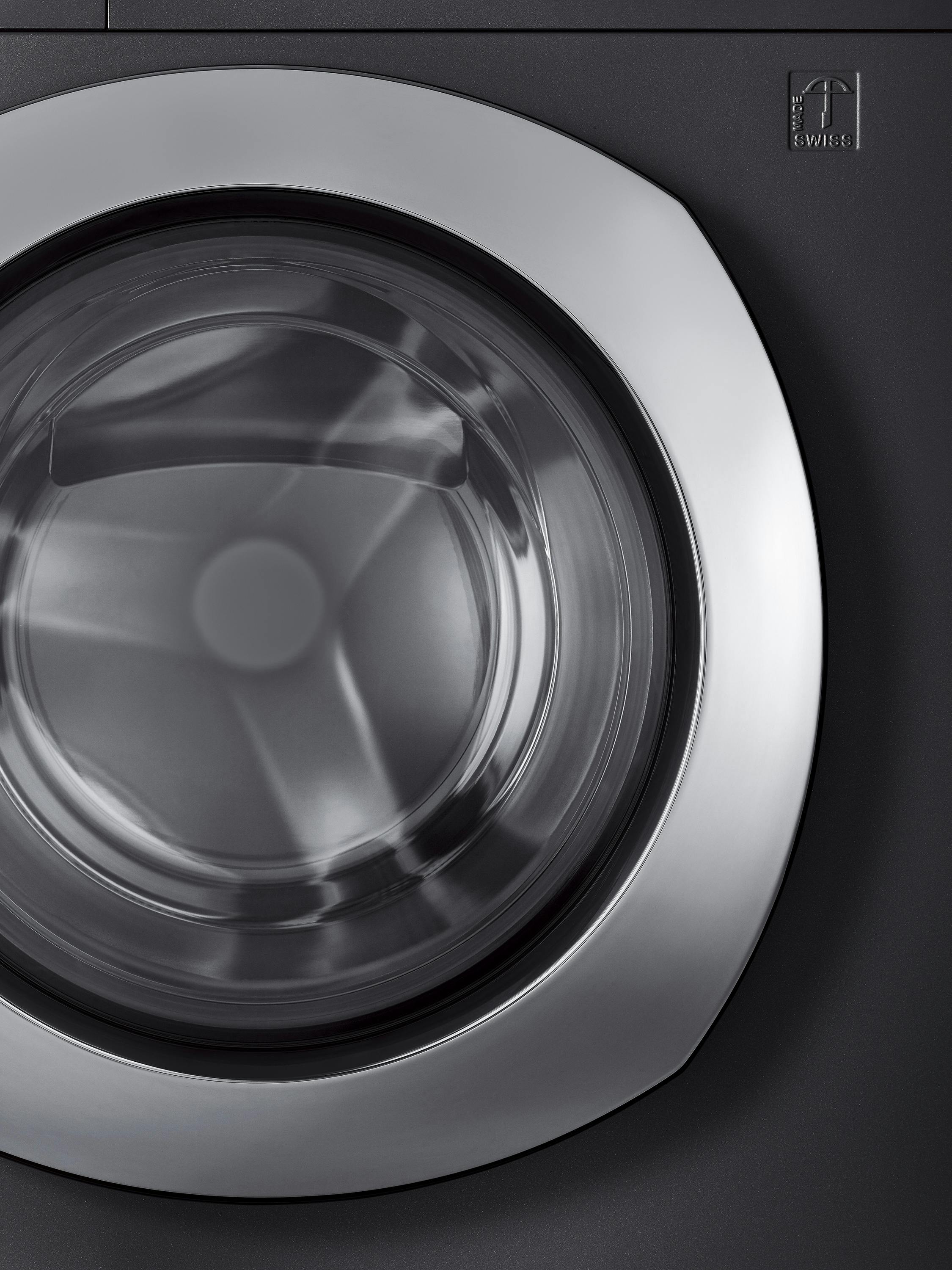 Close-up of the chrome steel front of a washing machine