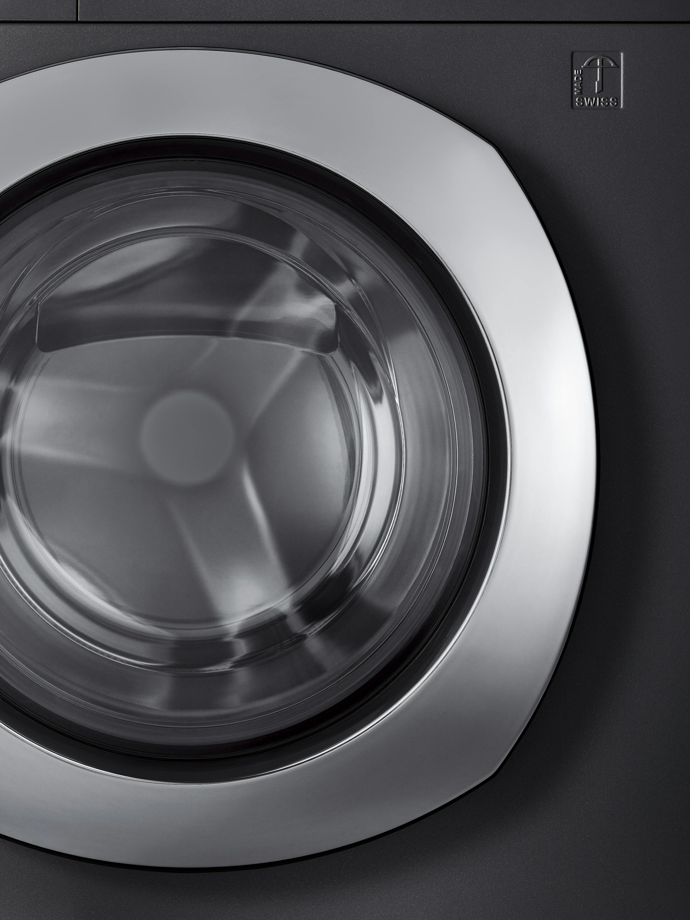 Close-up of the chrome steel front of a washing machine