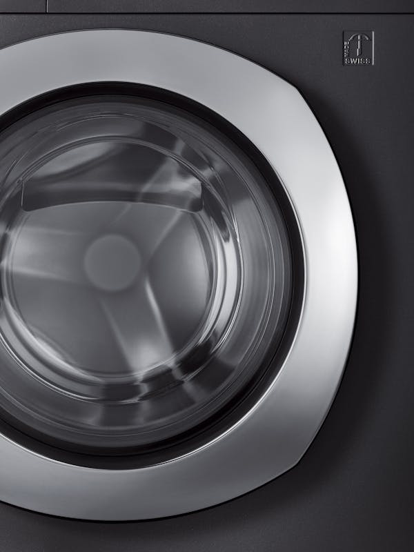 Close-up of the chrome steel front of a washing machine