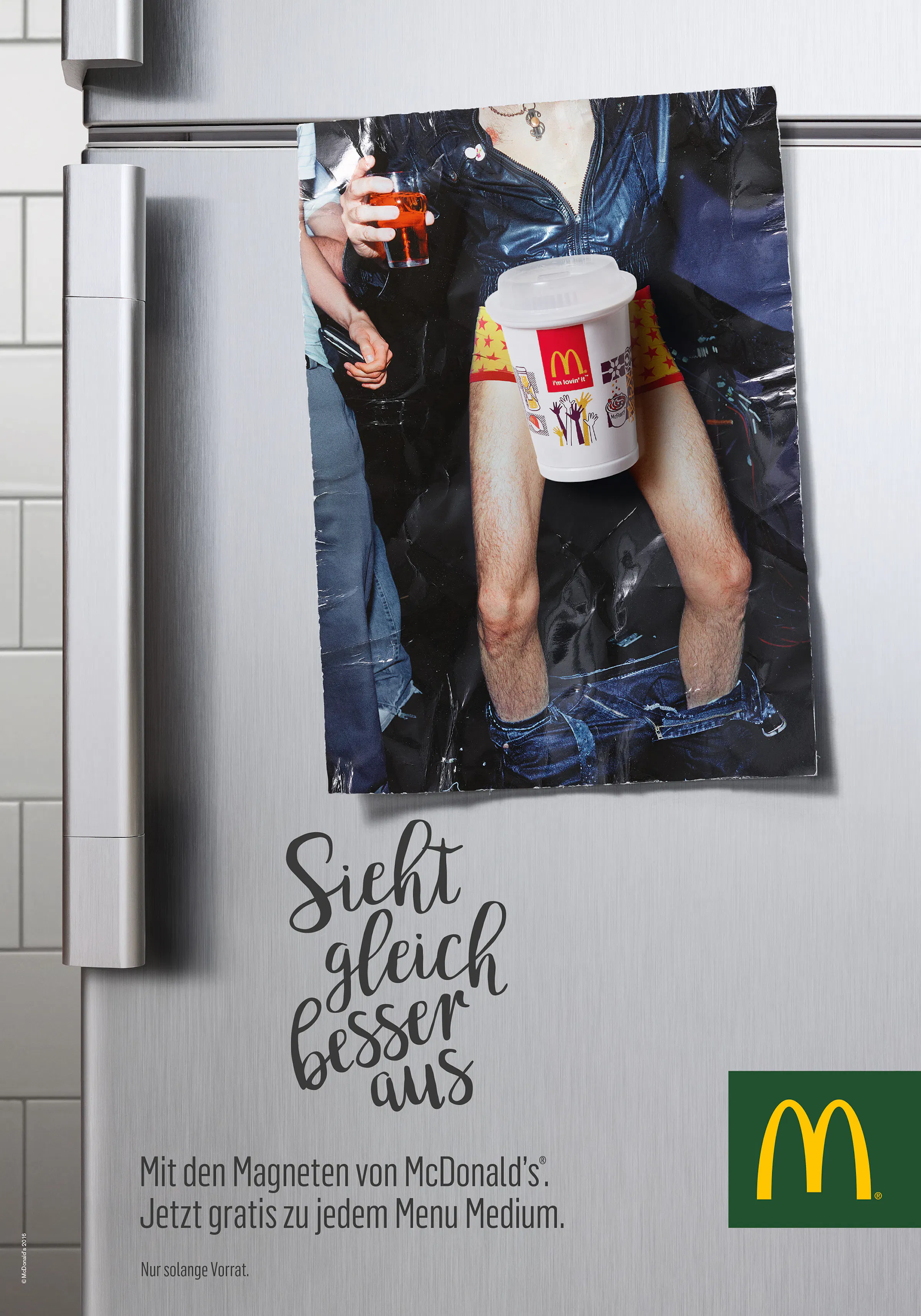 Postcard on a fridge with a magnet in the shape of a soft ice