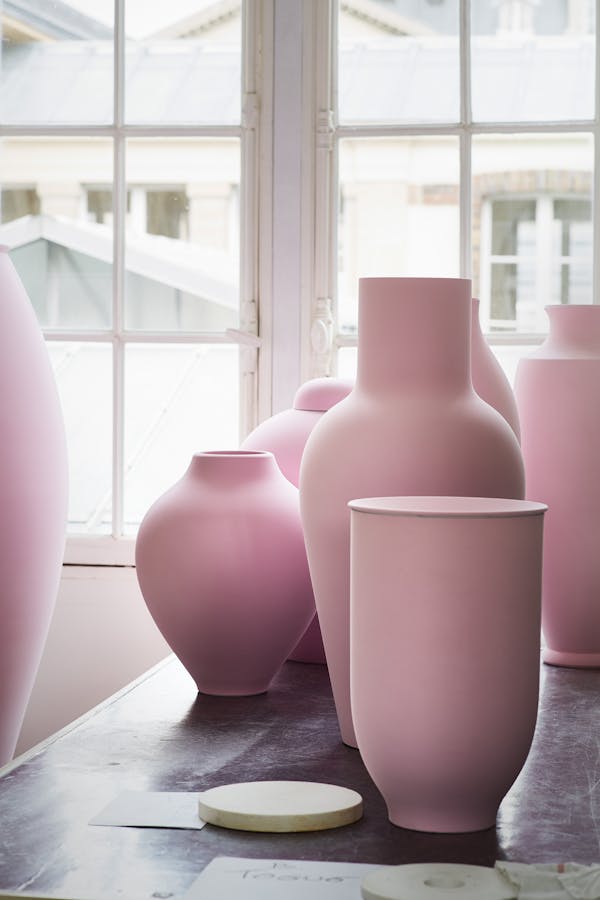 Large pink porcelain vases on a table