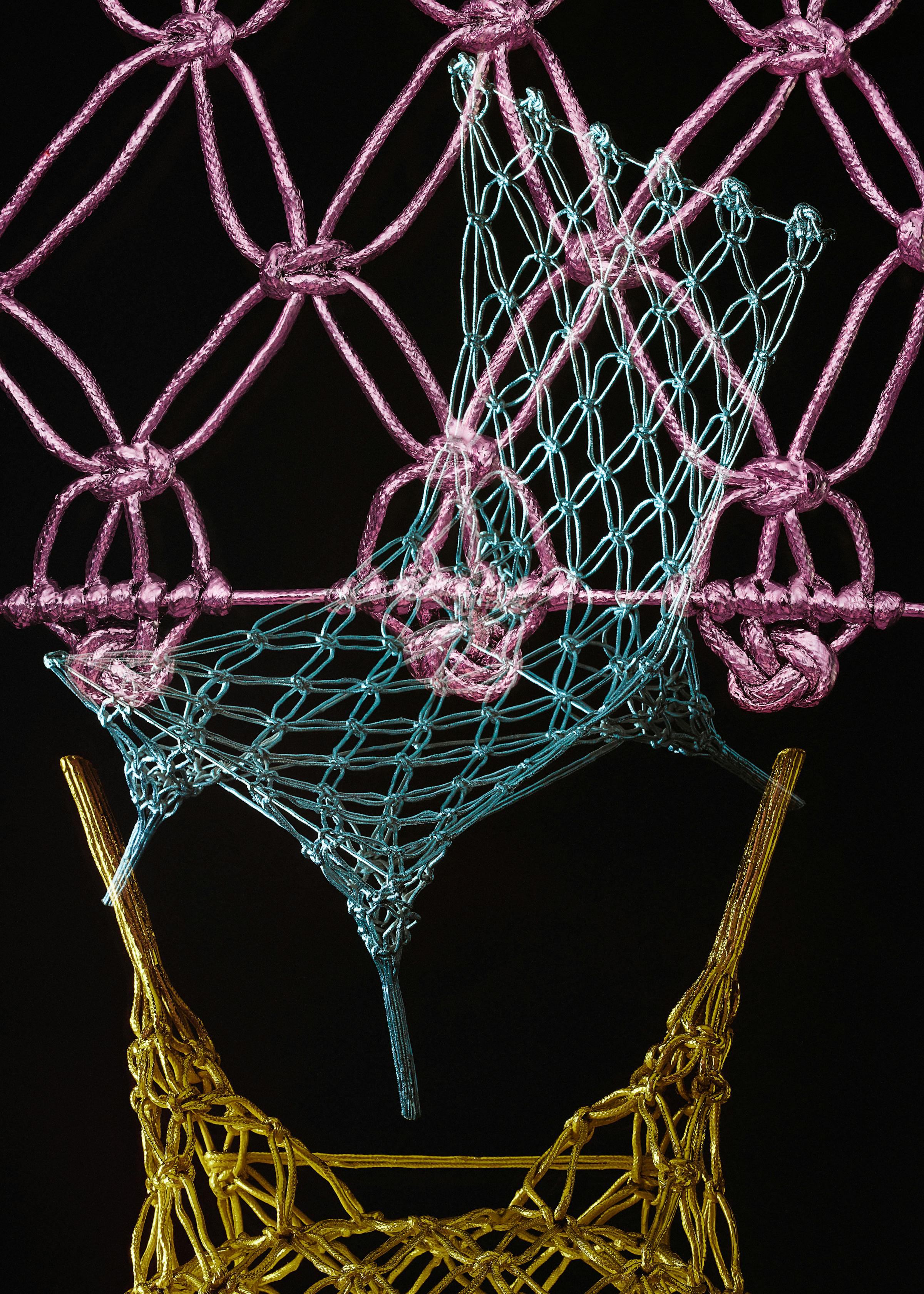 Multiple analogue exposure of the knotted chair by designer Marcel Wanders in the colors pink, blue and gold