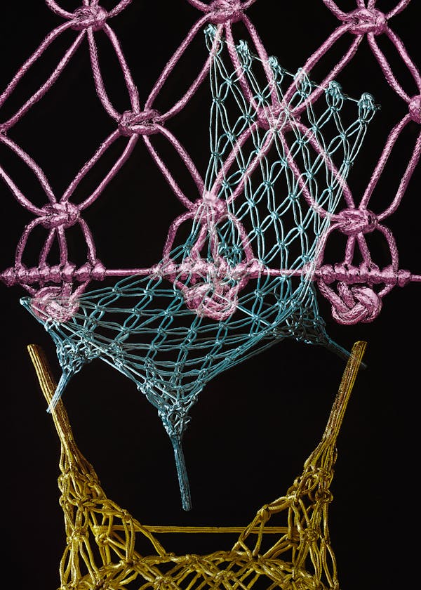 Multiple analogue exposure of the knotted chair by designer Marcel Wanders in the colors pink, blue and gold