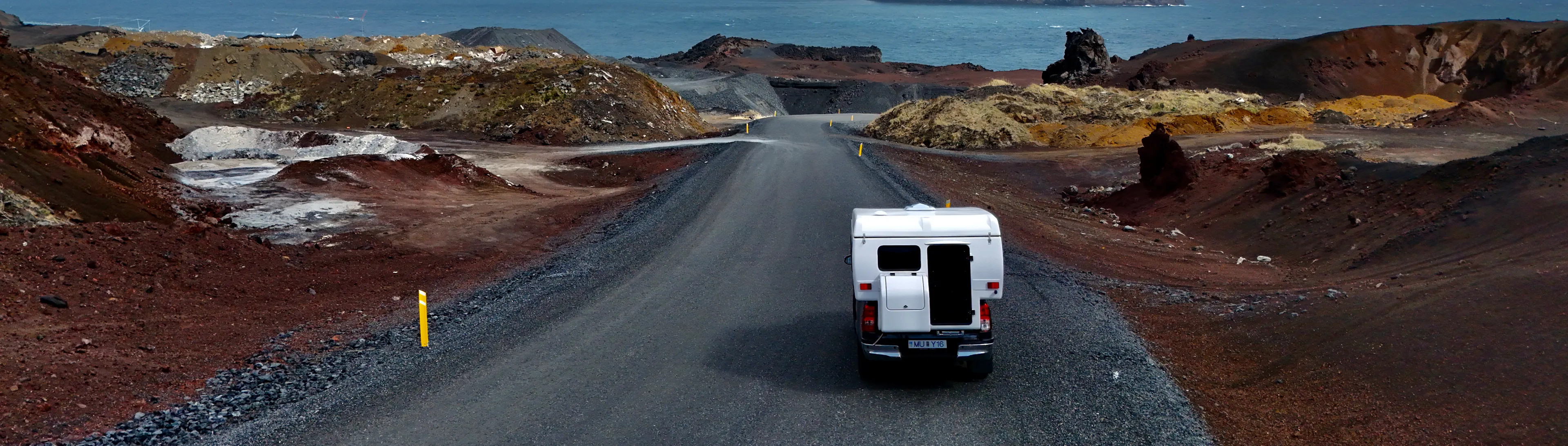 Camper van coastal road aerial