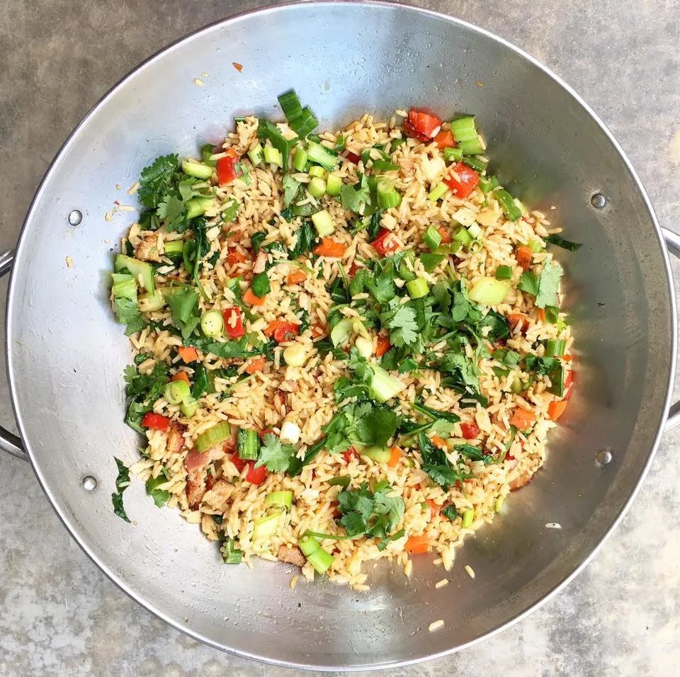 Chicken fried rice in a bowl from above.