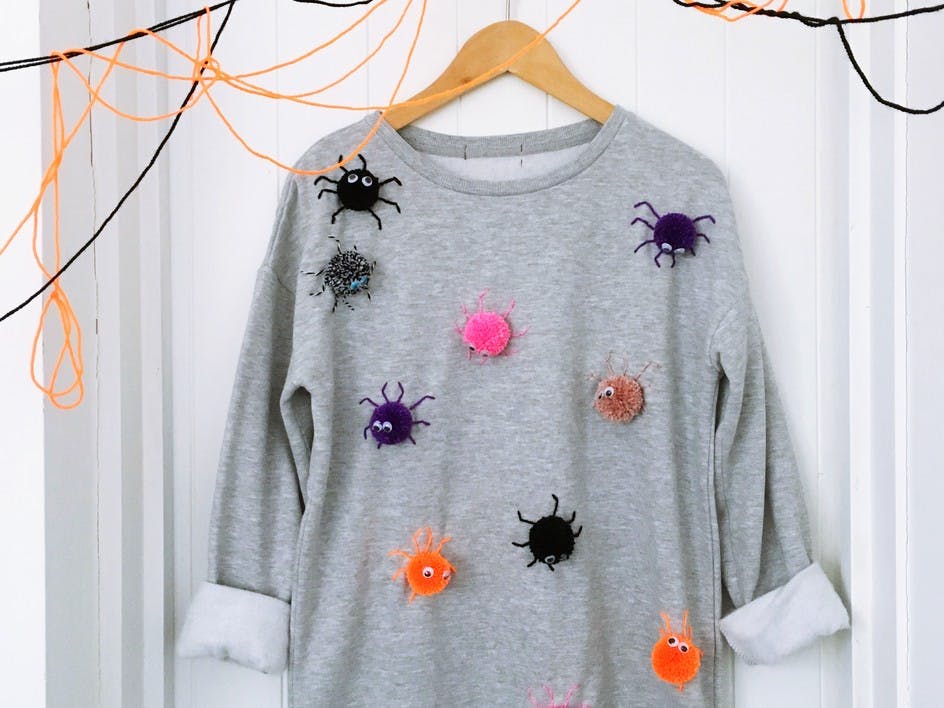 Make a spooky pom pom sweatshirt