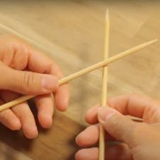 step Step 2 - Hold your needles with your fingers and thumbs