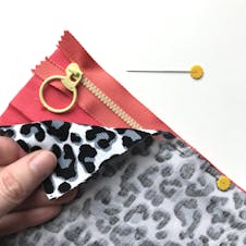 close up of lining and fabric pinned to zip