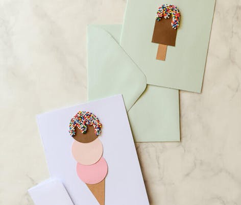 paper cut out icecream with multicoloured sweets to decorate
