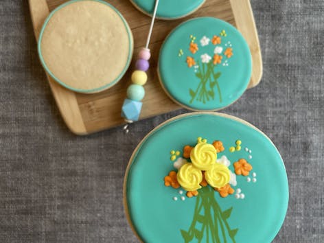 Learn how to ice your sugar cookies using royal icing with these fabulous floral designs