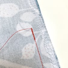 Close up of back tack stitching on bag seam