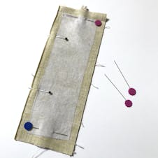 Fabric pinned together before sewing