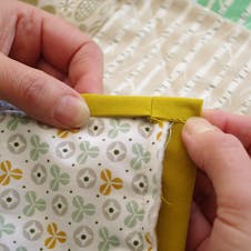 fold the edge and hand stitch