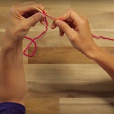 how to purl: bring the right needle through the stitch