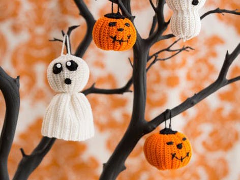 Ghost and pumpkin knitted Halloween decorations
