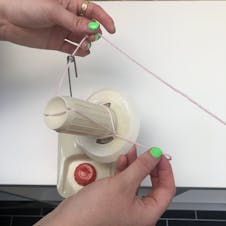 thread hank through your yarn winder