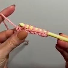 YO and pull through 2 loops
