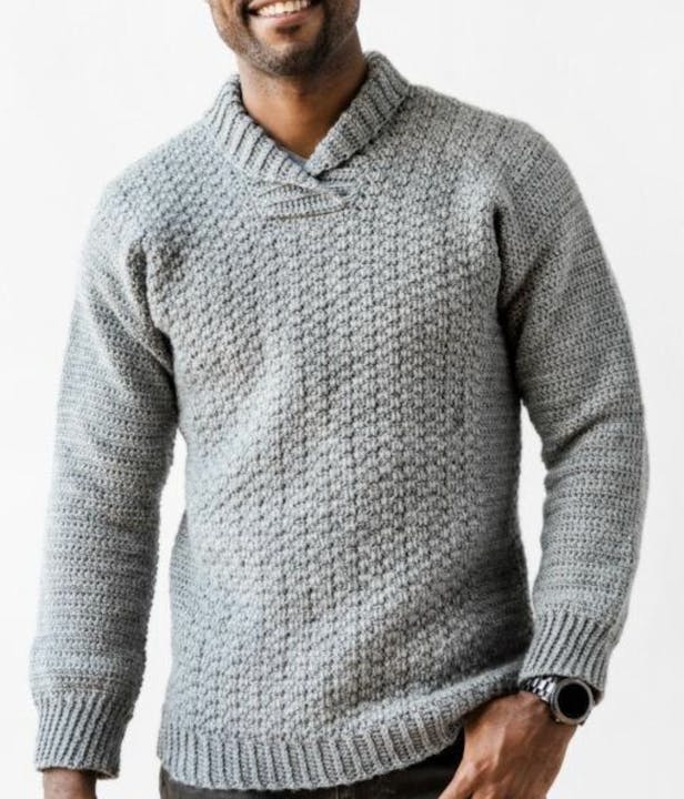 Man wearing a light grey crochet sweater with a nice collar