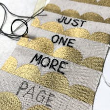 Close up of embroidery over pen marks