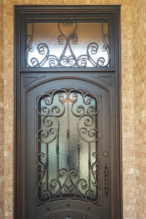 Custom-designed iron door and transom, showcasing personalized craftsmanship and style.
