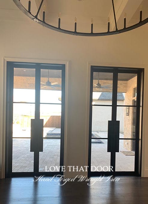 Iron double doors with stunning geometric shapes and bold lines