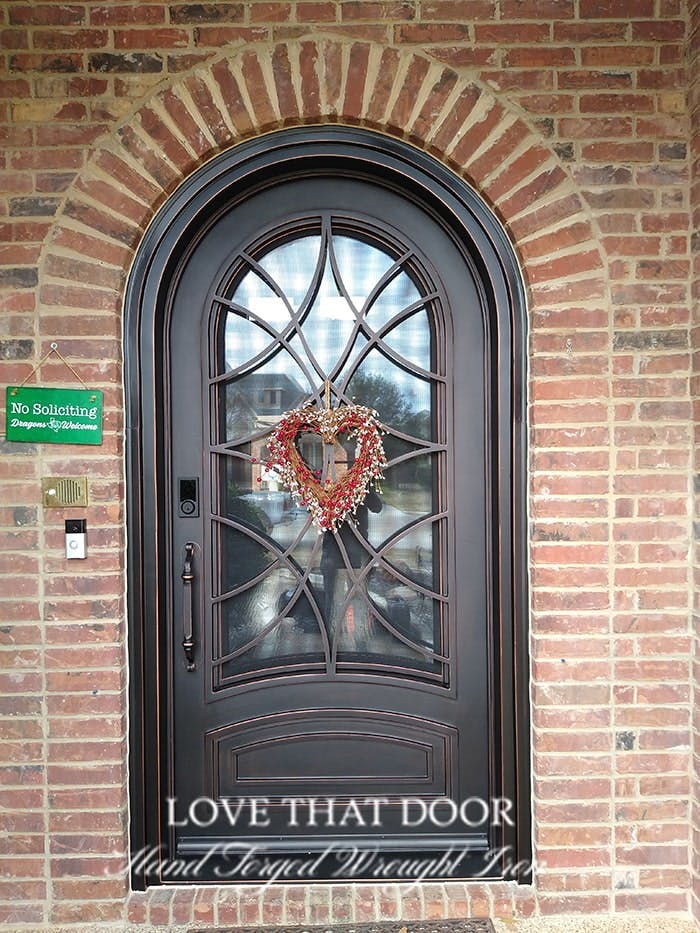 Single iron door with beautiful patina finish and vintage appeal