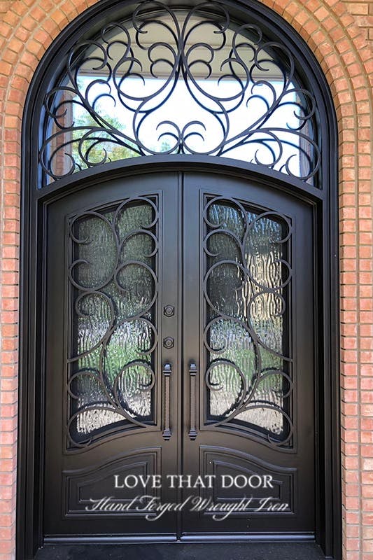 Artfully crafted door transom with a combination of clear and frosted glass.