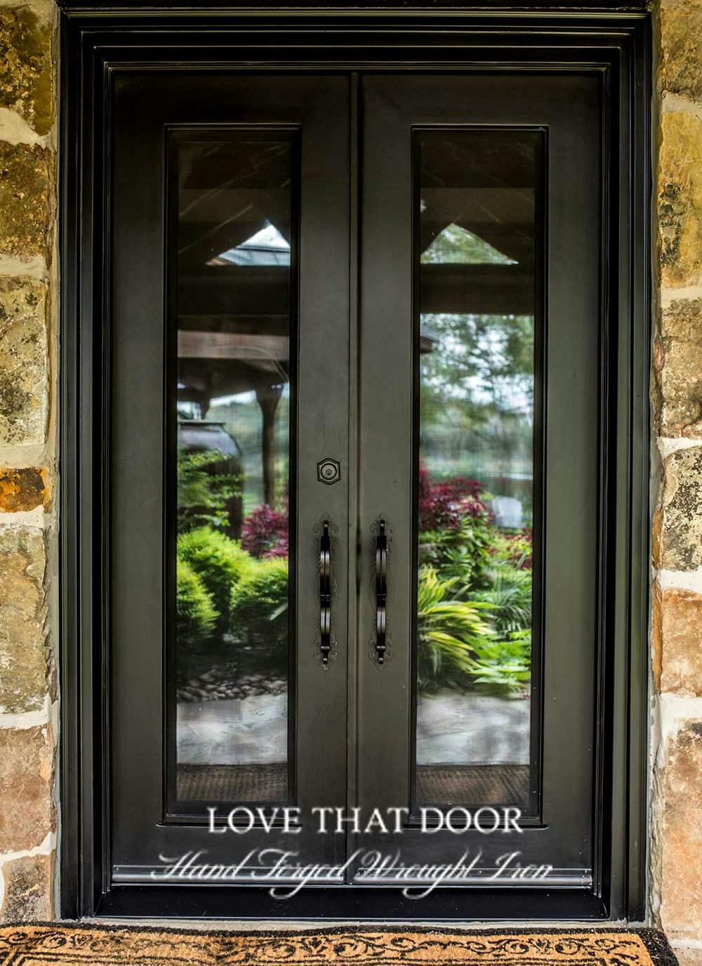 Hand-forged iron double doors with rustic charm and authentic craftsmanship