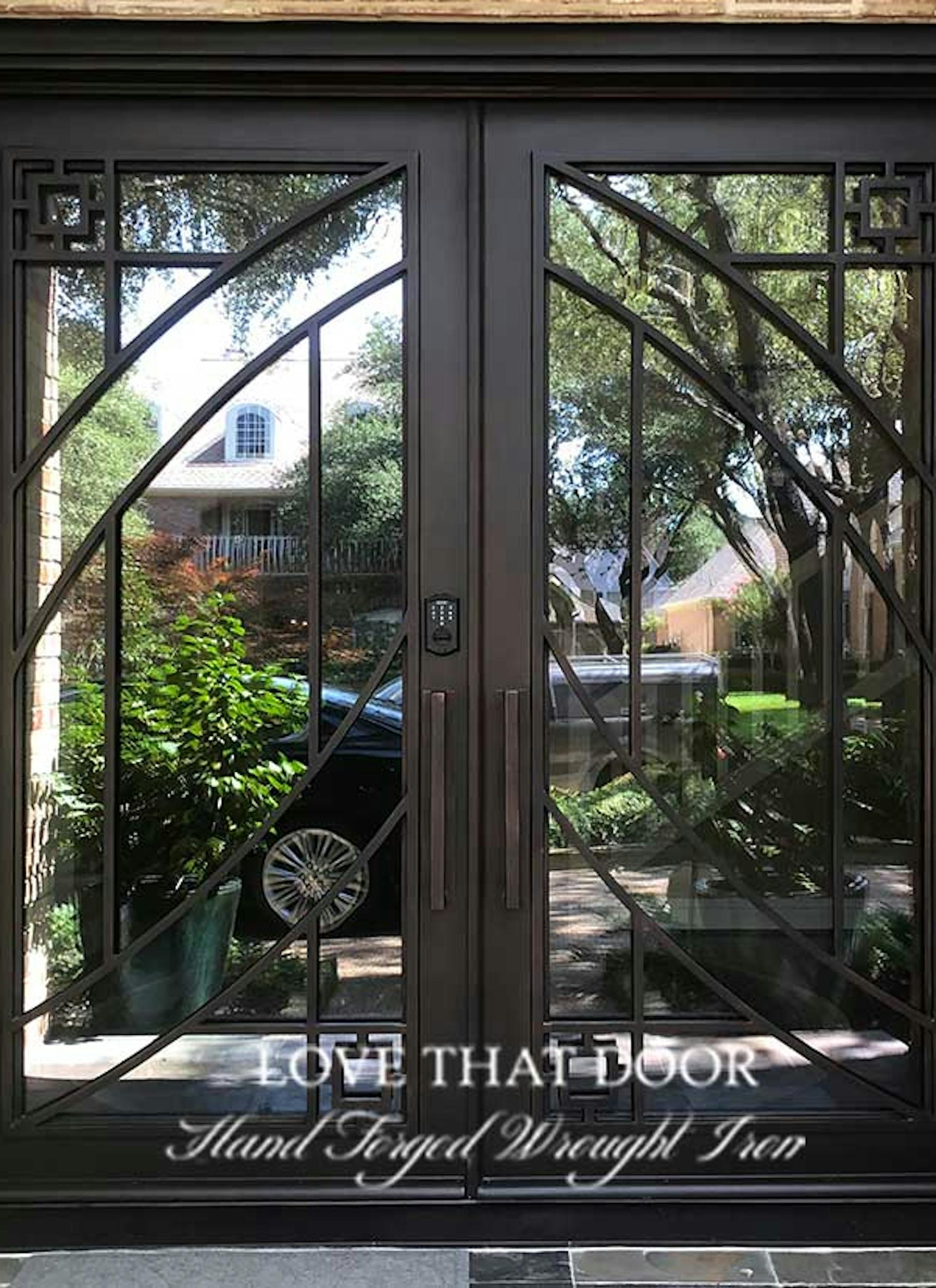 Iron double doors with double sidelights for added natural light and curb appeal