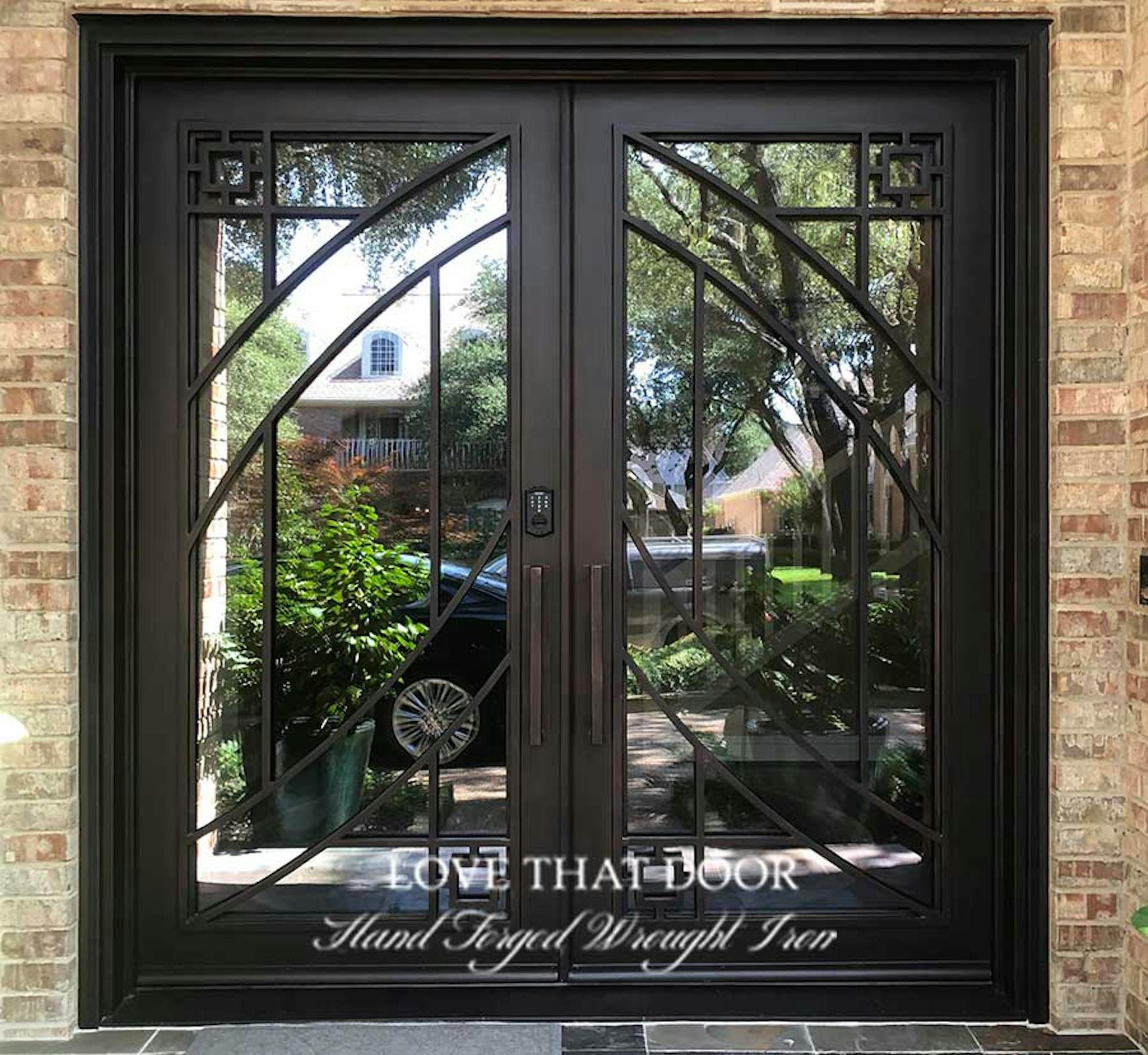 Iron double doors with double sidelights for added natural light and curb appeal