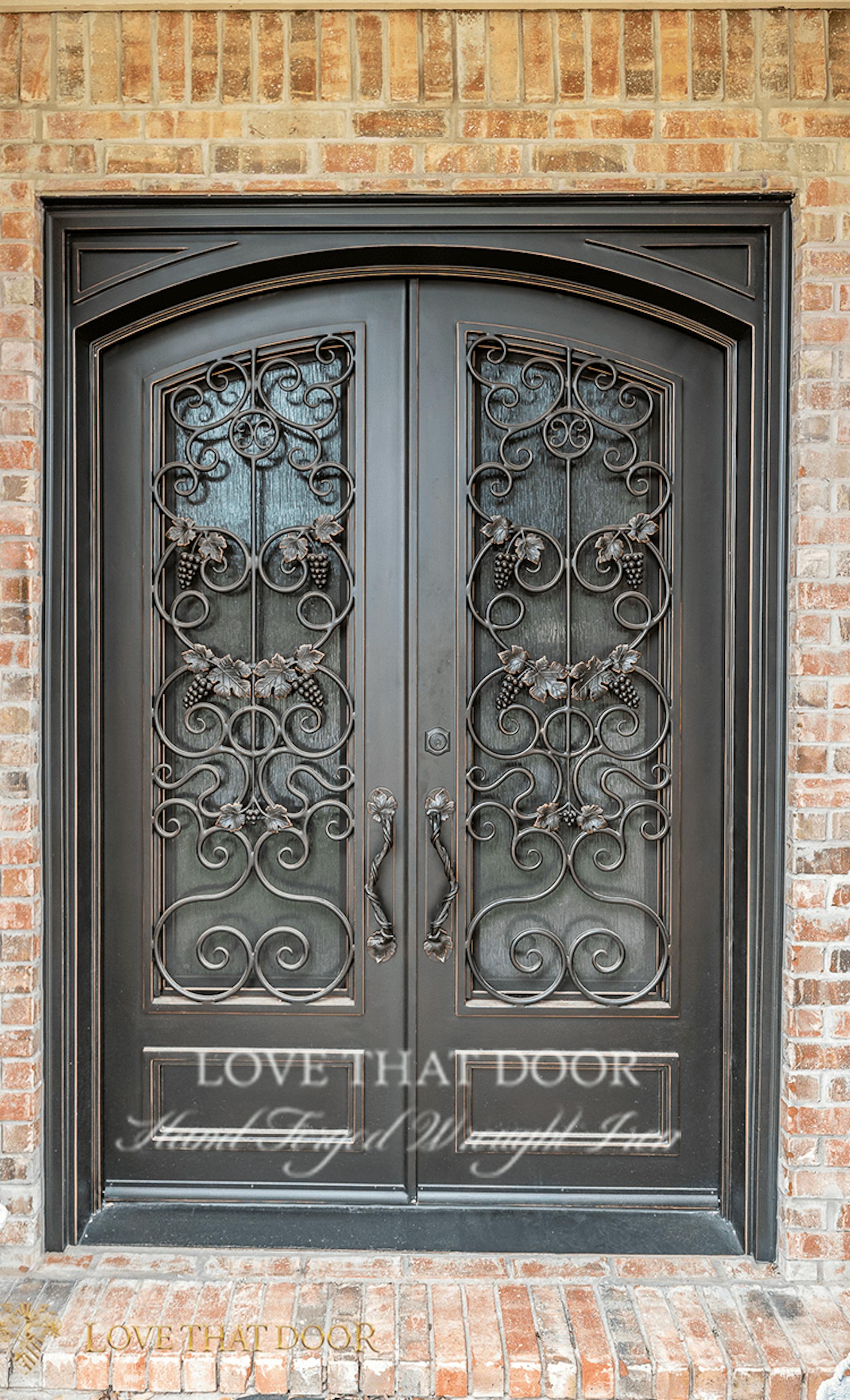 Handcrafted iron double doors with personalized monogram or emblem