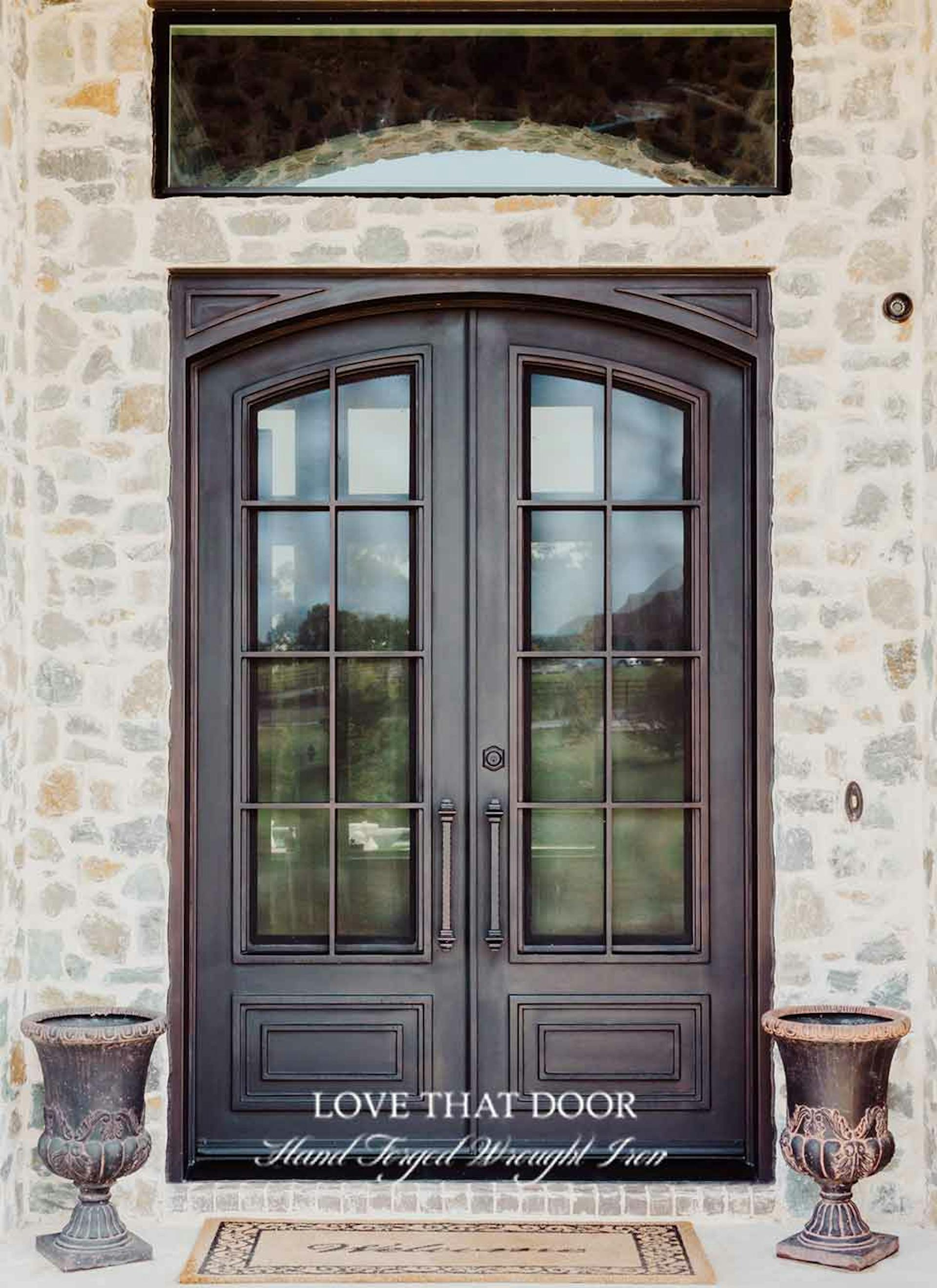 Hand-forged iron double doors with rustic charm and authentic craftsmanship