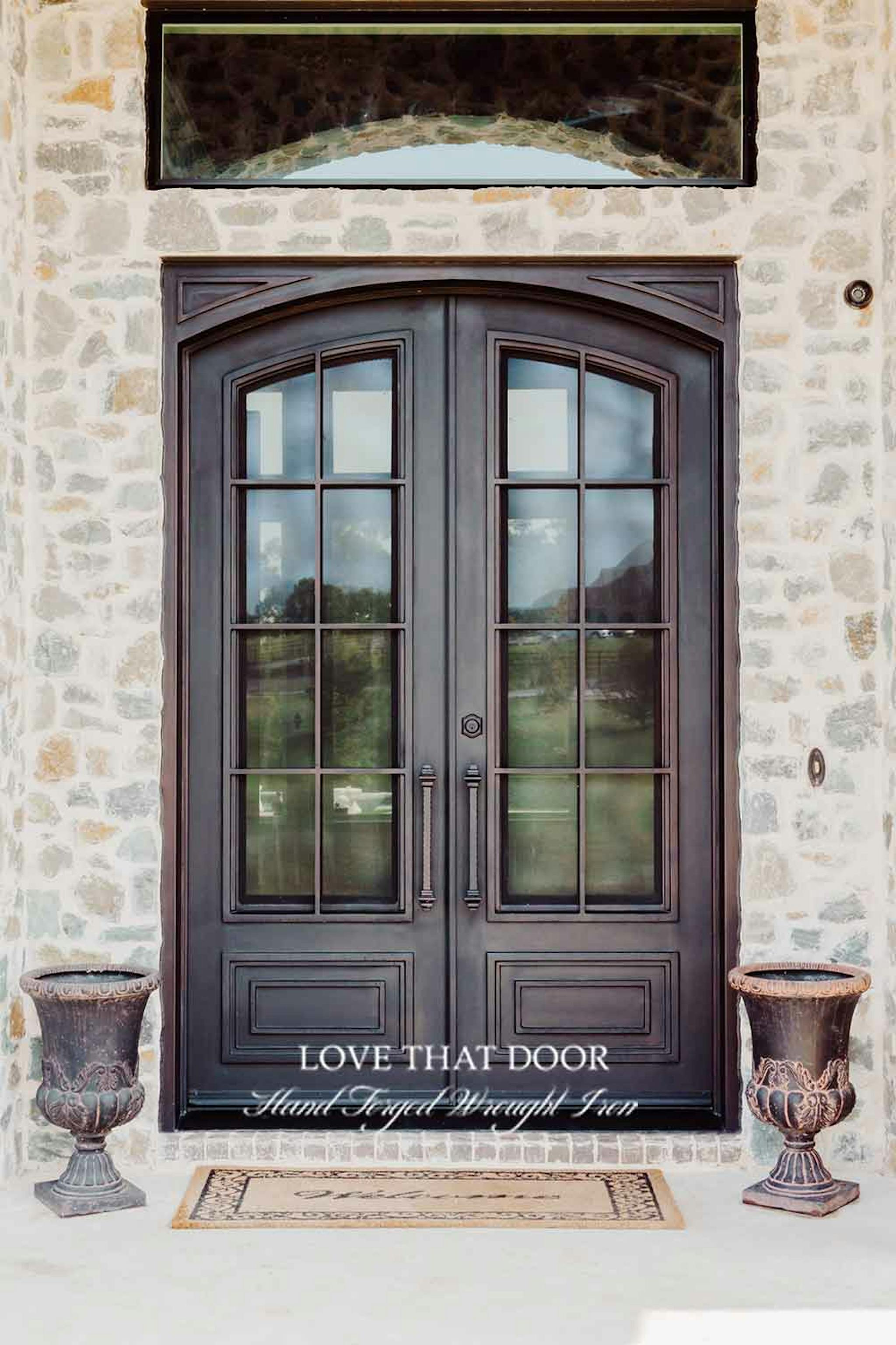 Hand-forged iron double doors with rustic charm and authentic craftsmanship