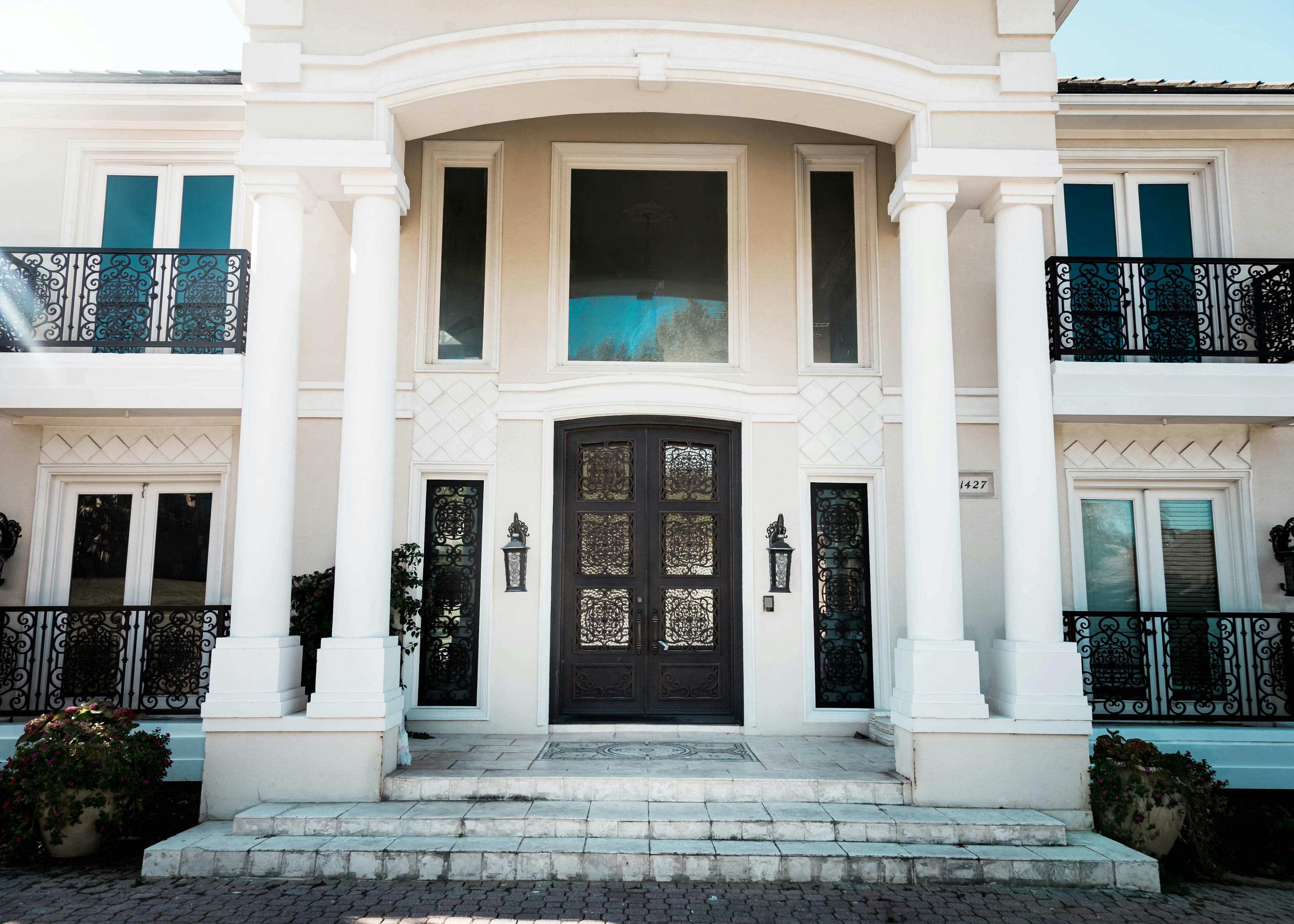 Enhance your home's allure with stunning iron double doors, a perfect blend of beauty and security.