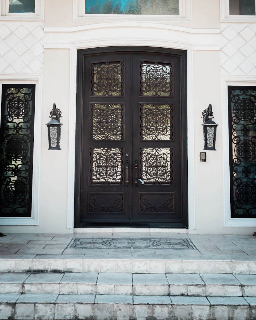 Exquisite iron double doors for a grand entrance with timeless elegance.