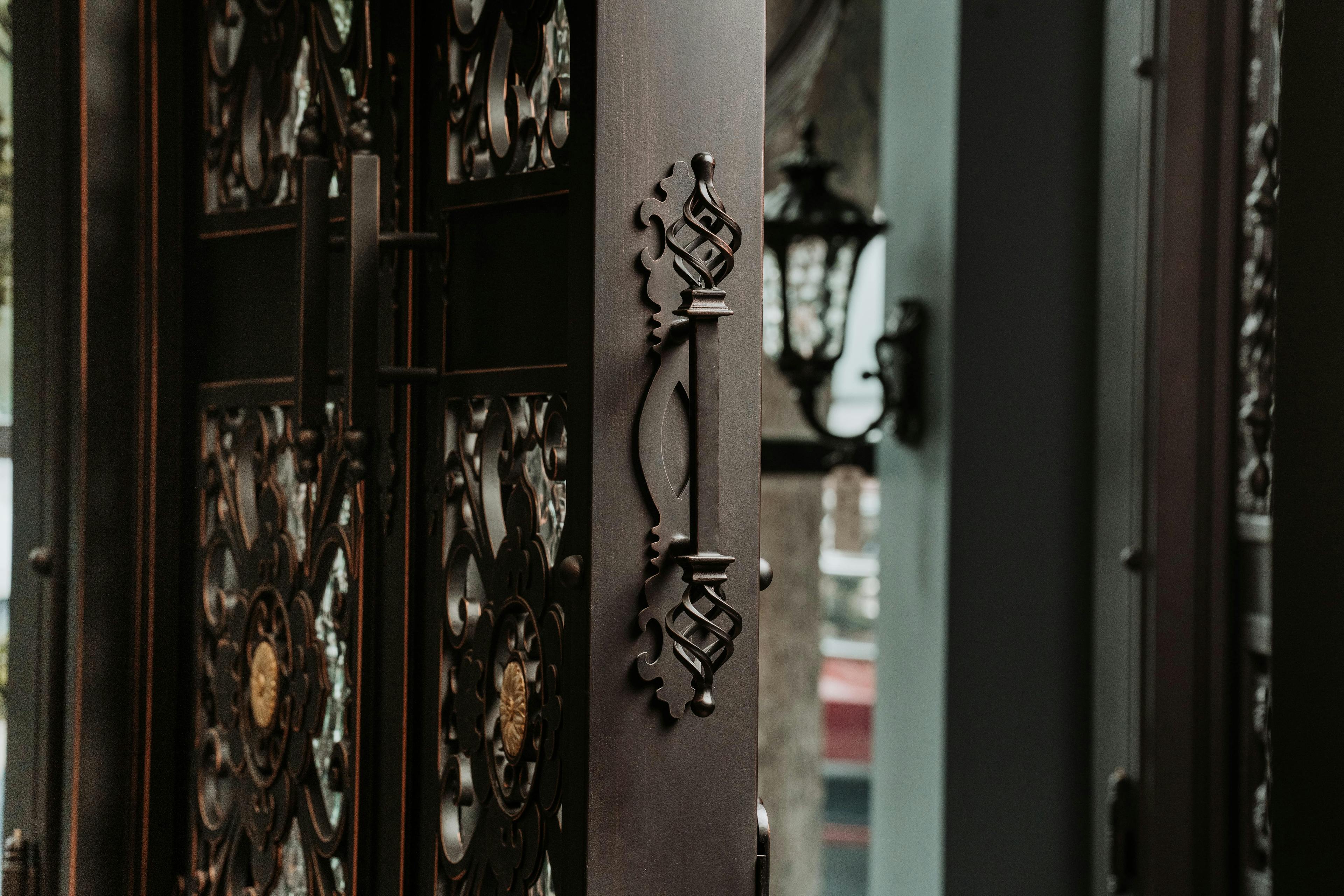 Custom wrought iron door with decorative grillwork and patterns