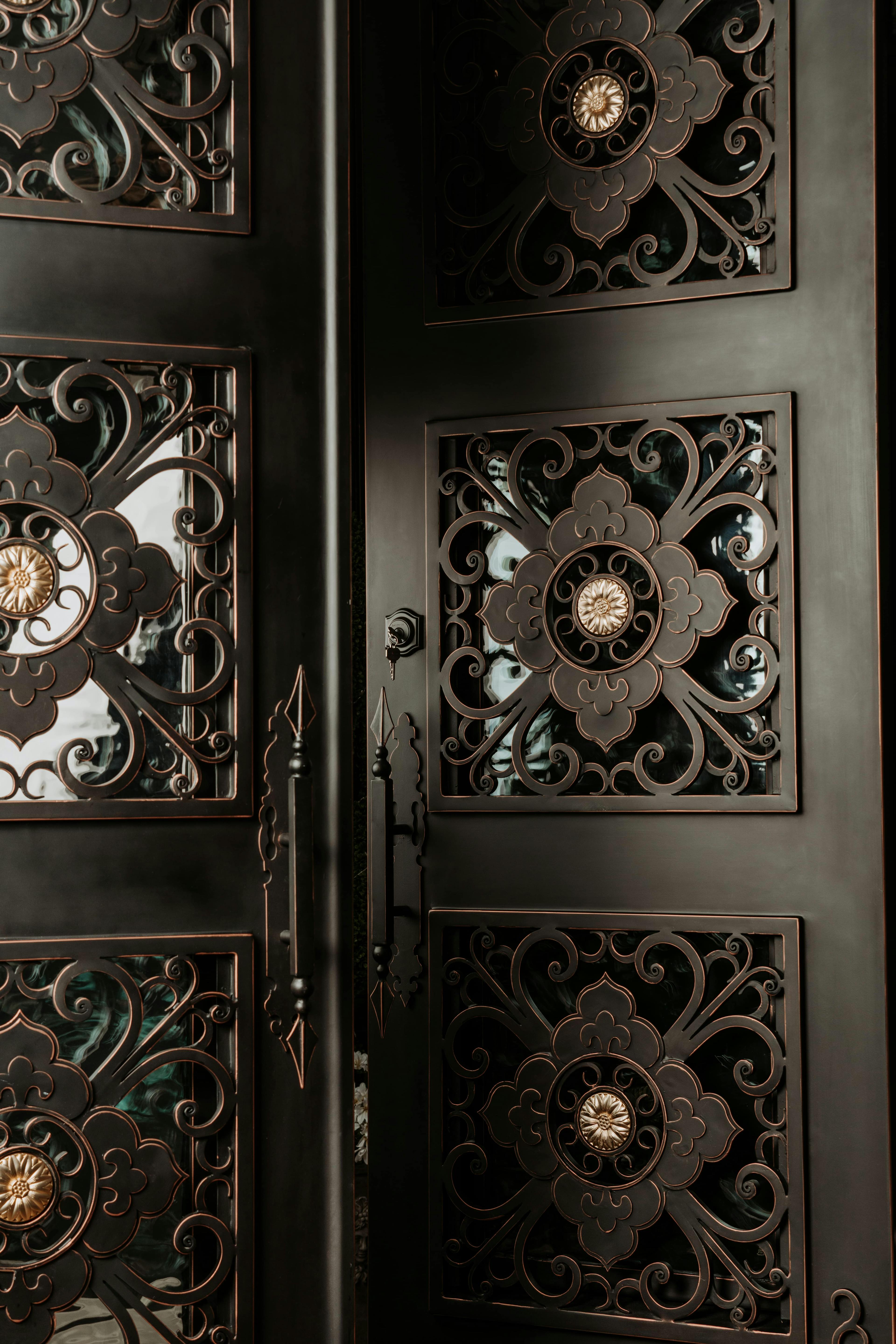 Iron door with beautiful finishes and elegant curves for timeless appeal