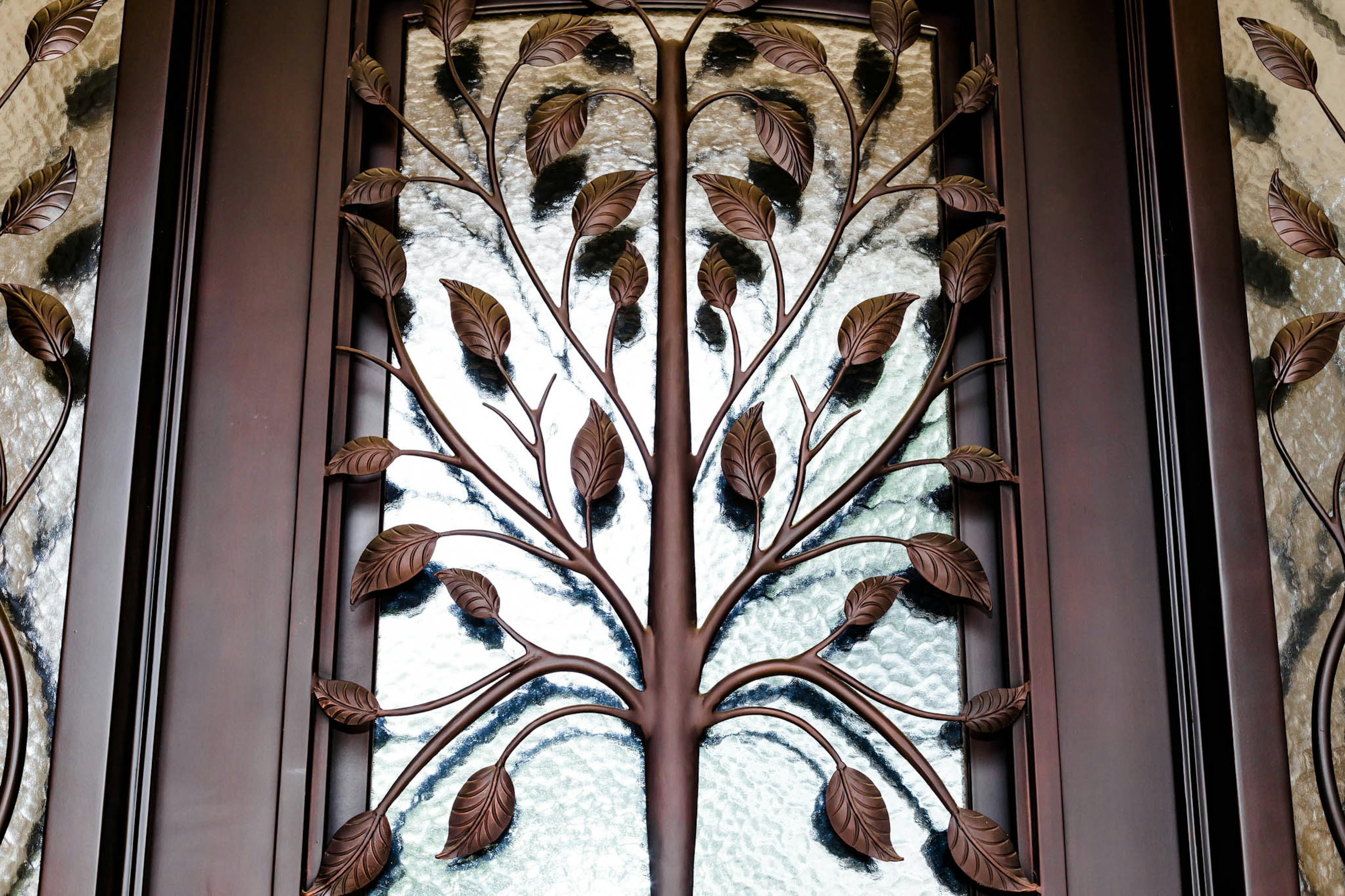 ron door with intricate metalwork and decorative grilles for added style