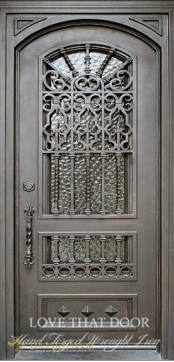 Handcrafted single iron door with unique design and arched top